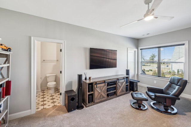 interior space with carpet flooring, baseboards, and ceiling fan