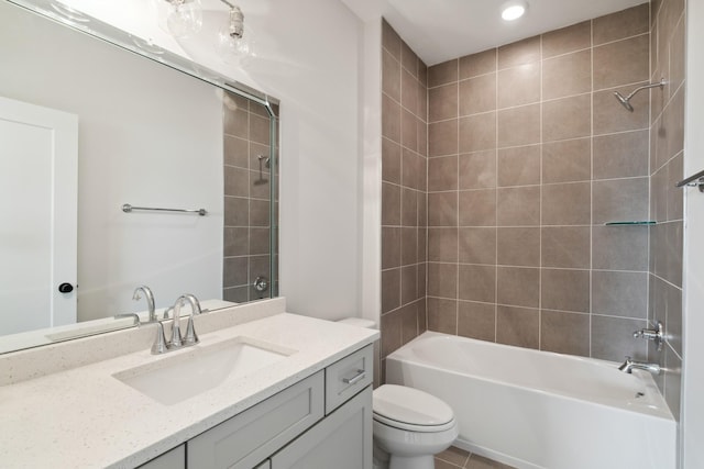 full bath with toilet, vanity, and shower / washtub combination