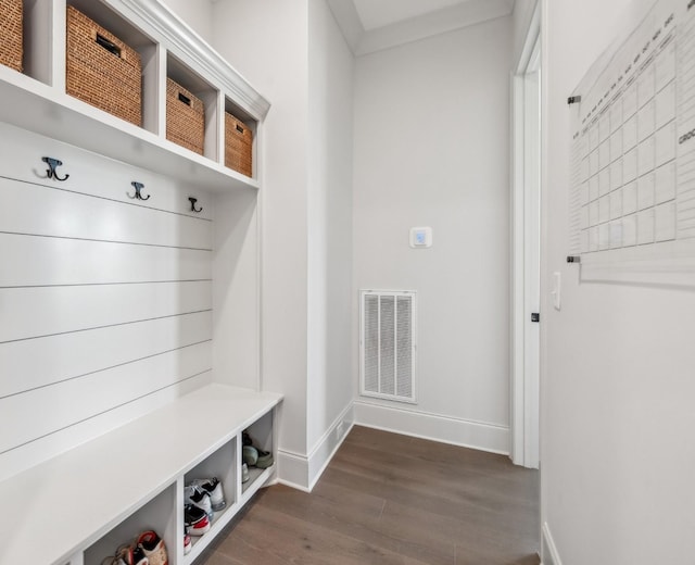 mudroom featuring baseboards, dark wood-style flooring, and visible vents