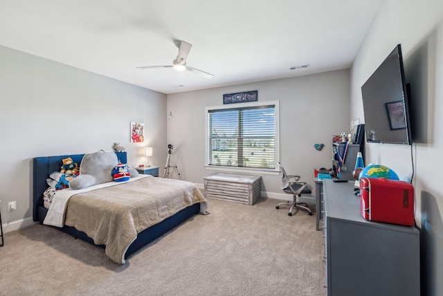 bedroom with baseboards, ceiling fan, visible vents, and light carpet