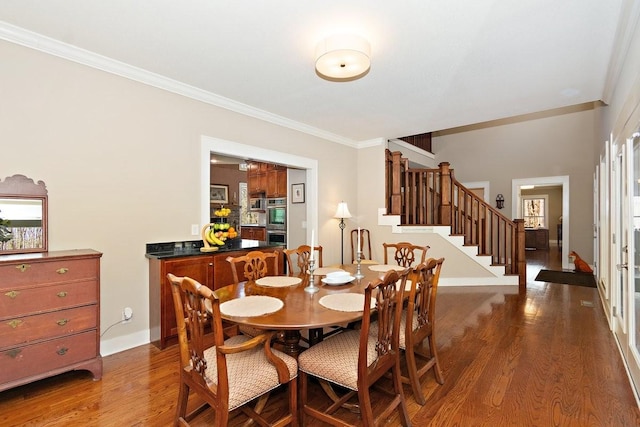 1748 Riverhaven Dr, Adams, TN 37010 - dining area with baseboards, stairs, ornamental molding, and wood finished floors