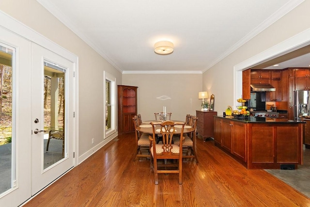 1748 Riverhaven Dr, Adams, TN 37010 - dining space with dark wood finished floors and crown molding