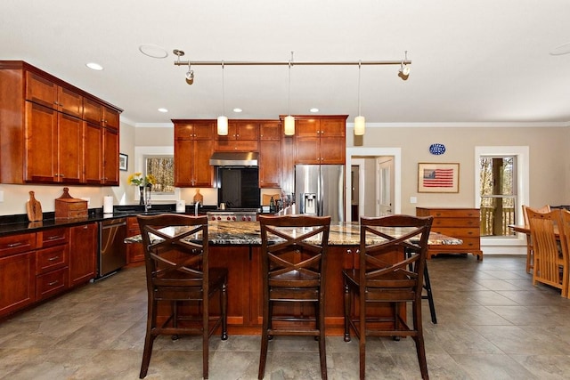 1748 Riverhaven Dr, Adams, TN 37010 - kitchen featuring a center island, under cabinet range hood, stainless steel appliances, decorative light fixtures, and ornamental molding