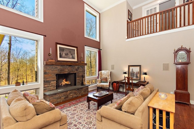 1748 Riverhaven Dr, Adams, TN 37010 - living room with a fireplace, wood finished floors, a healthy amount of sunlight, and crown molding