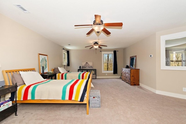 1748 Riverhaven Dr, Adams, TN 37010 - bedroom with light colored carpet, visible vents, ceiling fan, and baseboards