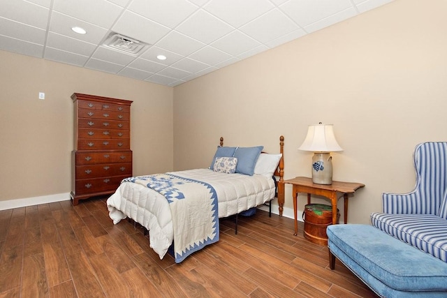 1748 Riverhaven Dr, Adams, TN 37010 - bedroom featuring baseboards, visible vents, a paneled ceiling, and wood finished floors