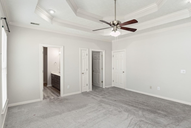 102 Highland Rdg, Hendersonville, TN 37075 - unfurnished bedroom with crown molding, baseboards, ensuite bath, carpet floors, and a tray ceiling