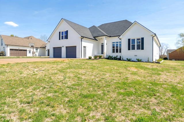 view of front of property featuring a front lawn, driveway, and a garage