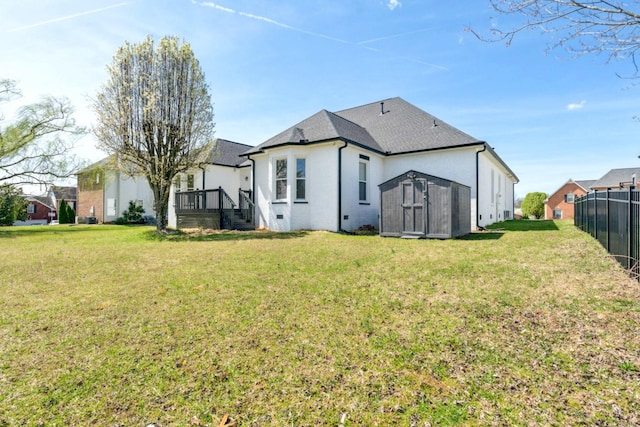102 Highland Rdg, Hendersonville, TN 37075 - back of house with an outbuilding, a storage unit, fence, and a yard