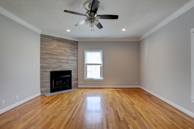 526 Christel Springs Dr, Clarksville, TN 37043 - unfurnished living room featuring light wood-style flooring, ornamental molding, baseboards, and a tile fireplace