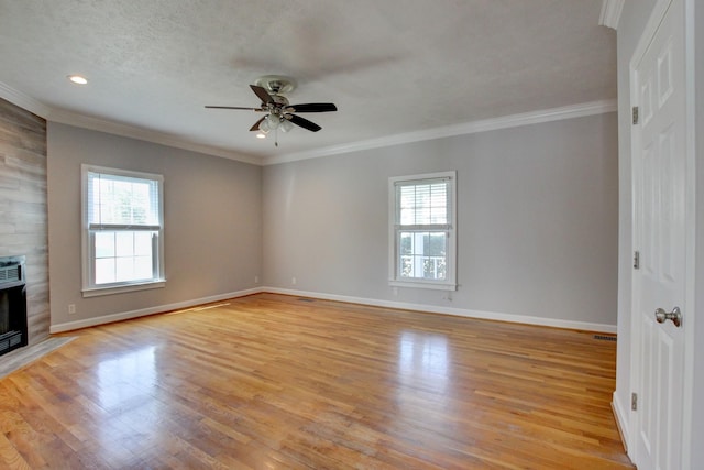 526 Christel Springs Dr, Clarksville, TN 37043 - unfurnished living room featuring crown molding, light wood finished floors, a textured ceiling, baseboards, and ceiling fan
