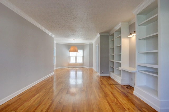 526 Christel Springs Dr, Clarksville, TN 37043 - unfurnished living room featuring wood finished floors, crown molding, baseboards, and a textured ceiling