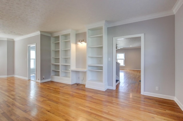 526 Christel Springs Dr, Clarksville, TN 37043 - unfurnished living room featuring baseboards, light wood-type flooring, crown molding, and a ceiling fan