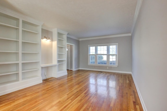 526 Christel Springs Dr, Clarksville, TN 37043 - unfurnished living room featuring baseboards, wood finished floors, an inviting chandelier, and crown molding