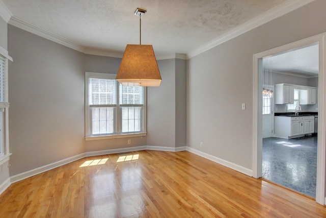 526 Christel Springs Dr, Clarksville, TN 37043 - empty room featuring baseboards, a wealth of natural light, light wood-style floors, and crown molding