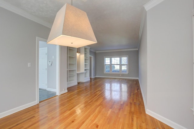 526 Christel Springs Dr, Clarksville, TN 37043 - unfurnished living room featuring baseboards, light wood-type flooring, and crown molding
