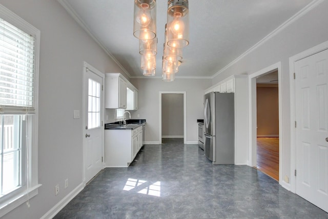 526 Christel Springs Dr, Clarksville, TN 37043 - kitchen featuring white cabinetry, crown molding, a sink, dark countertops, and freestanding refrigerator