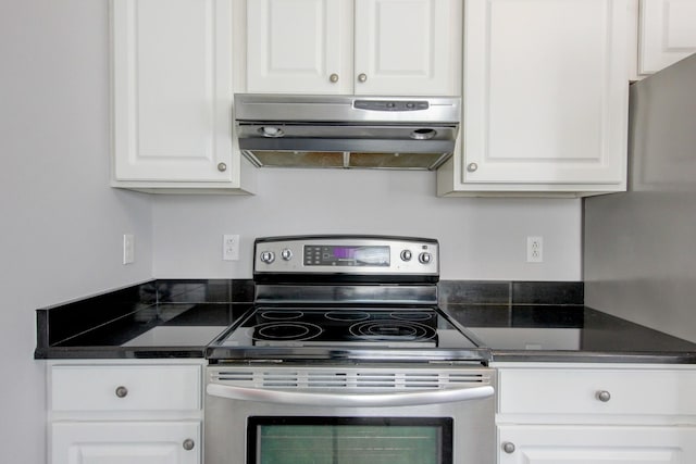 526 Christel Springs Dr, Clarksville, TN 37043 - kitchen featuring stainless steel range with electric cooktop, dark countertops, white cabinetry, and extractor fan