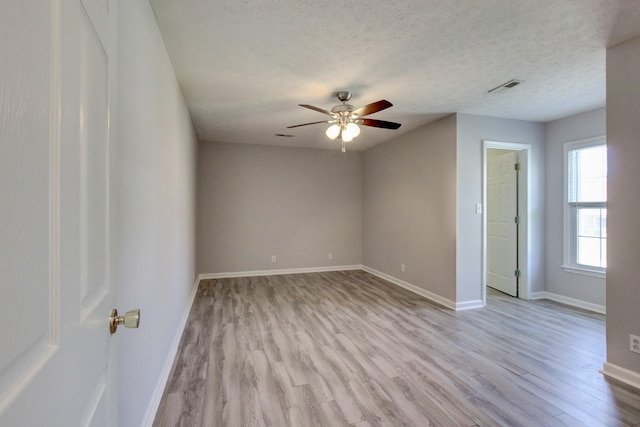 526 Christel Springs Dr, Clarksville, TN 37043 - unfurnished room with a ceiling fan, a textured ceiling, light wood-type flooring, baseboards, and visible vents