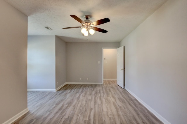 526 Christel Springs Dr, Clarksville, TN 37043 - unfurnished room featuring wood finished floors, a textured ceiling, baseboards, visible vents, and ceiling fan