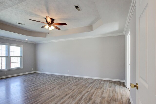 526 Christel Springs Dr, Clarksville, TN 37043 - spare room featuring baseboards, ceiling fan, wood finished floors, and a raised ceiling