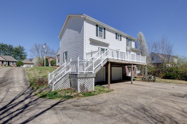 526 Christel Springs Dr, Clarksville, TN 37043 - view of front of property featuring driveway, a deck, a garage, and stairway