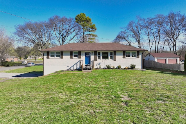 ranch-style house with a front lawn and fence