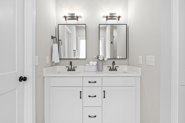 bathroom featuring double vanity and a sink