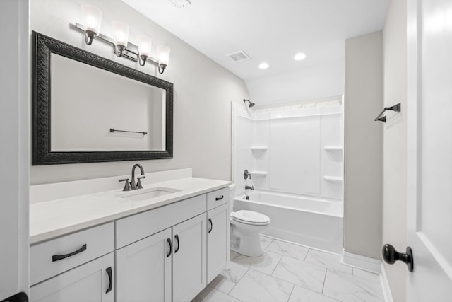 full bath featuring vanity, recessed lighting, toilet, marble finish floor, and washtub / shower combination