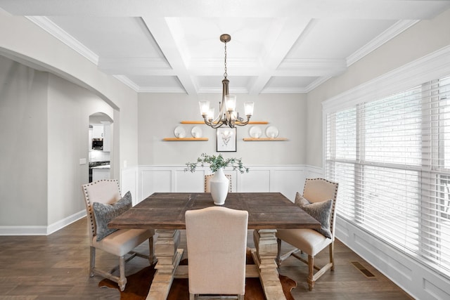 dining room with coffered ceiling, beam ceiling, a chandelier, visible vents, and dark wood-style flooring