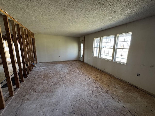 empty room with a textured ceiling