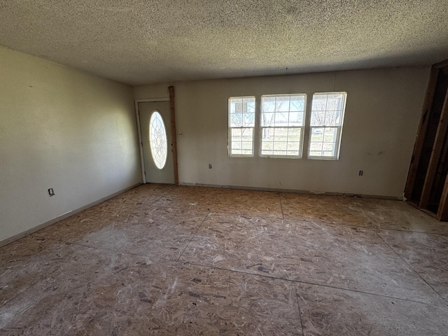 entryway featuring a textured ceiling