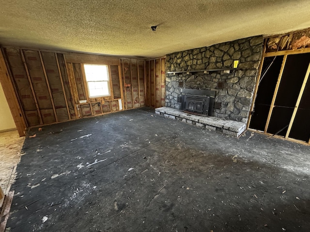 unfurnished living room with a textured ceiling