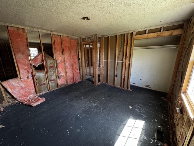 interior space with a textured ceiling