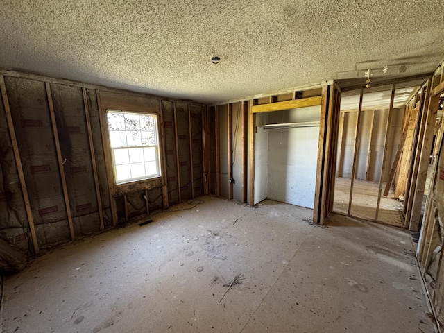 unfurnished bedroom featuring multiple closets and visible vents