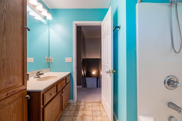 bathroom with shower / bathing tub combination and vanity