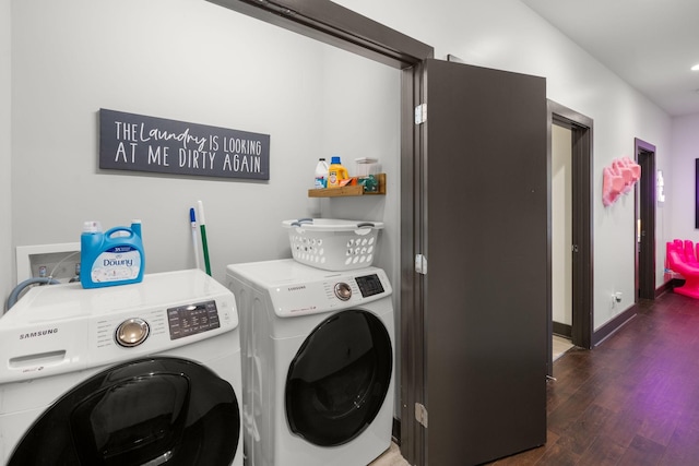washroom with baseboards, wood finished floors, laundry area, and separate washer and dryer