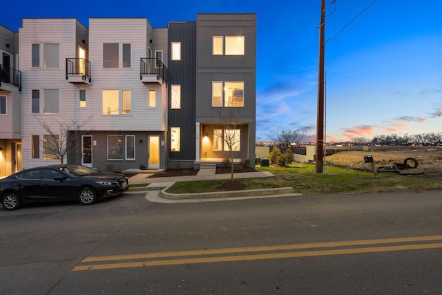 view of front of home featuring central AC and board and batten siding