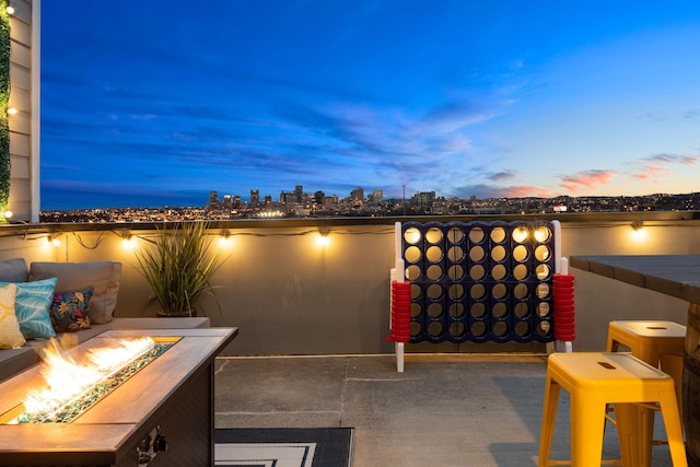 patio terrace at dusk with an outdoor fire pit