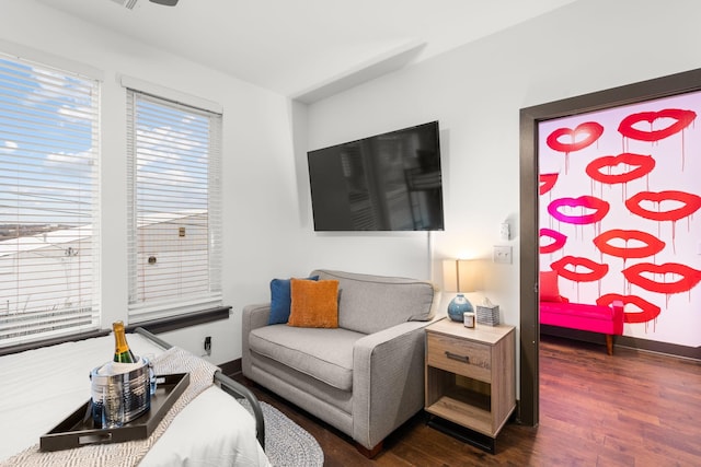 living room with dark wood-style floors and baseboards