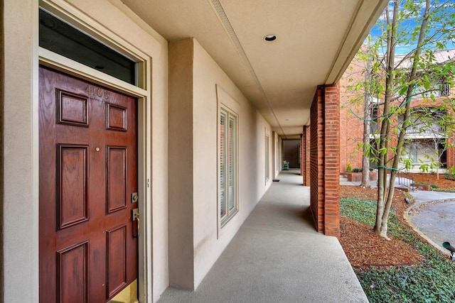 view of exterior entry featuring stucco siding