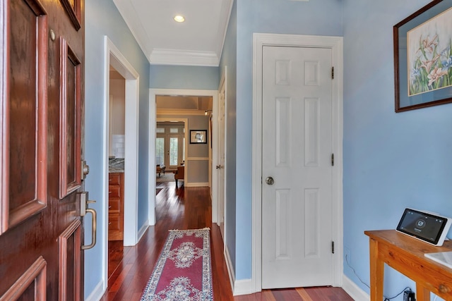 entryway featuring french doors, dark wood-style flooring, crown molding, and baseboards
