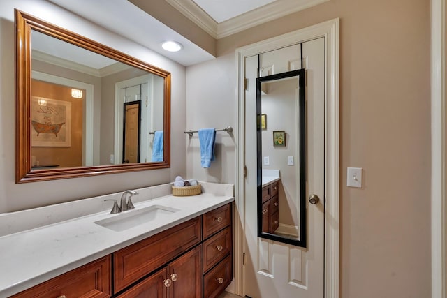 bathroom with vanity and ornamental molding