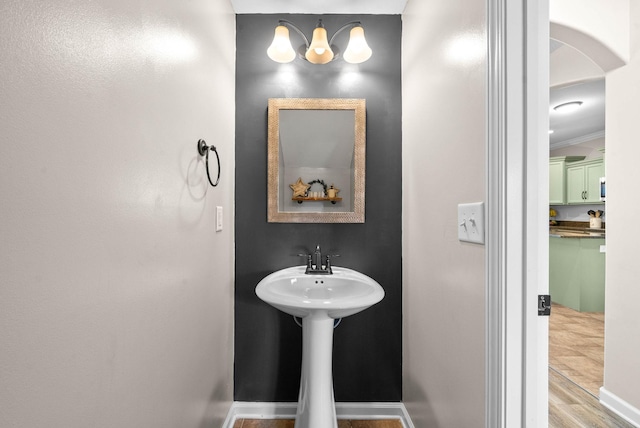 185 Kildeer Dr, Clarksville, TN 37040 - bathroom with baseboards, crown molding, and wood finished floors