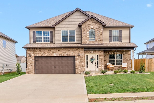 185 Kildeer Dr, Clarksville, TN 37040 - craftsman-style house featuring concrete driveway, fence, an attached garage, brick siding, and a porch