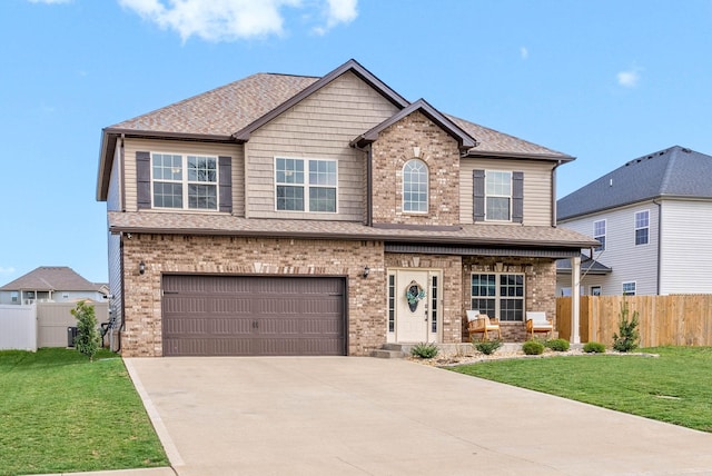 185 Kildeer Dr, Clarksville, TN 37040 - craftsman house featuring driveway, fence, a front lawn, and a porch
