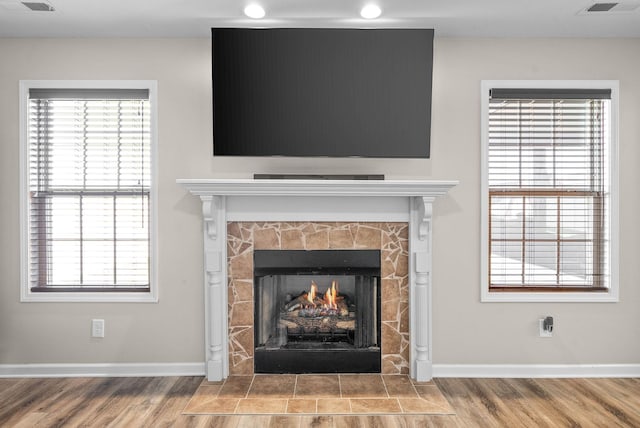 185 Kildeer Dr, Clarksville, TN 37040 - room details with baseboards, a fireplace, and wood finished floors