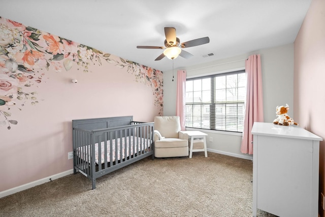 185 Kildeer Dr, Clarksville, TN 37040 - carpeted bedroom with a nursery area, baseboards, ceiling fan, and visible vents