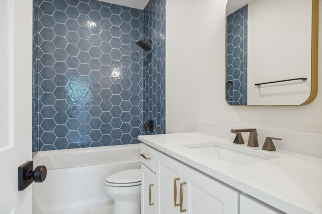 bathroom with bathtub / shower combination, toilet, and vanity