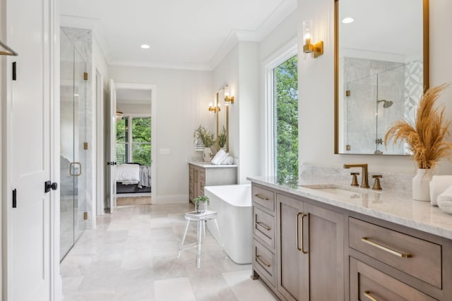 ensuite bathroom with ensuite bath, a stall shower, a soaking tub, and vanity